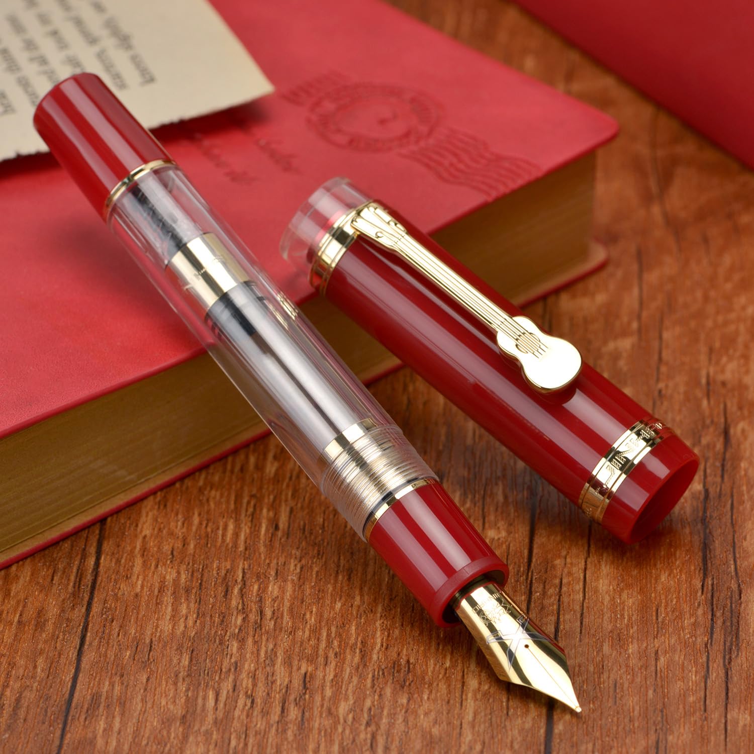 Jinhao 1935 Tiandao Series Fountain Pen – Red & Clear Acrylic Body, Dual tone Medium Nib Nib, Gold Guitar Clip With Large Converter