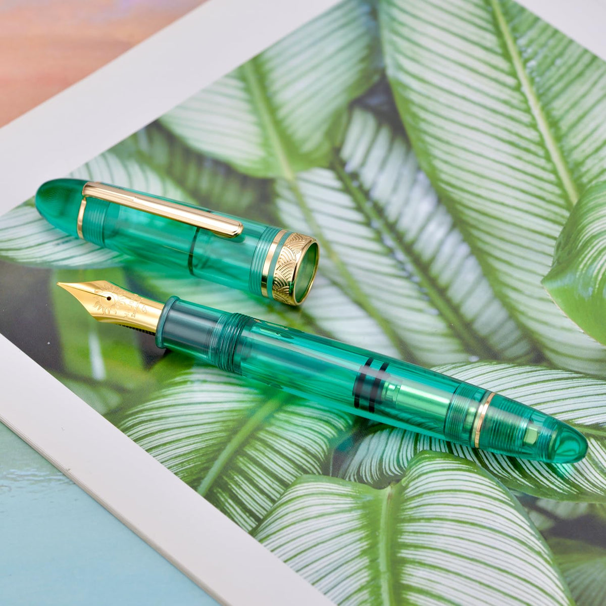 Moonman P140 Demonstrator Special Edition Fountain Pen – Transparent Green Resin, Size 8 Nib, Brass Piston Filling, Gold Trim