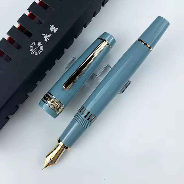 Wing Sung 629 Special Edition Piston Fountain Pen - Exclusive Blue-Grey Resin Barrel, Gold Trim, Transparent Fence Window, 0.5mm Iridium Fine Nib