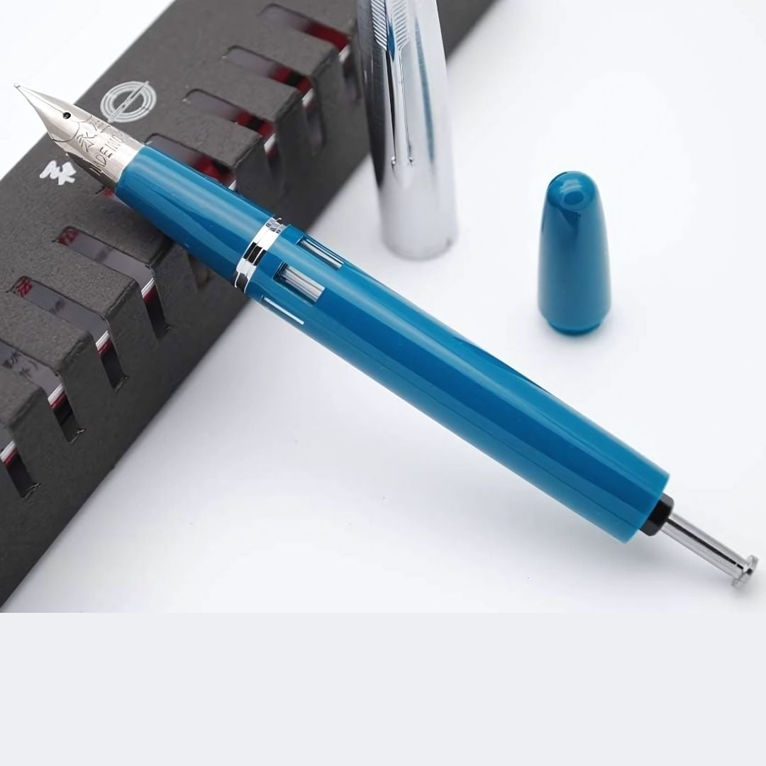 Wing Sung 601A Blue-Green Steel Cap Vacumatic Fountain Pen with Ink Window – 0.5mm Fine Nib, Resin Body, Push-Cap with Converter & Box (No Ink)